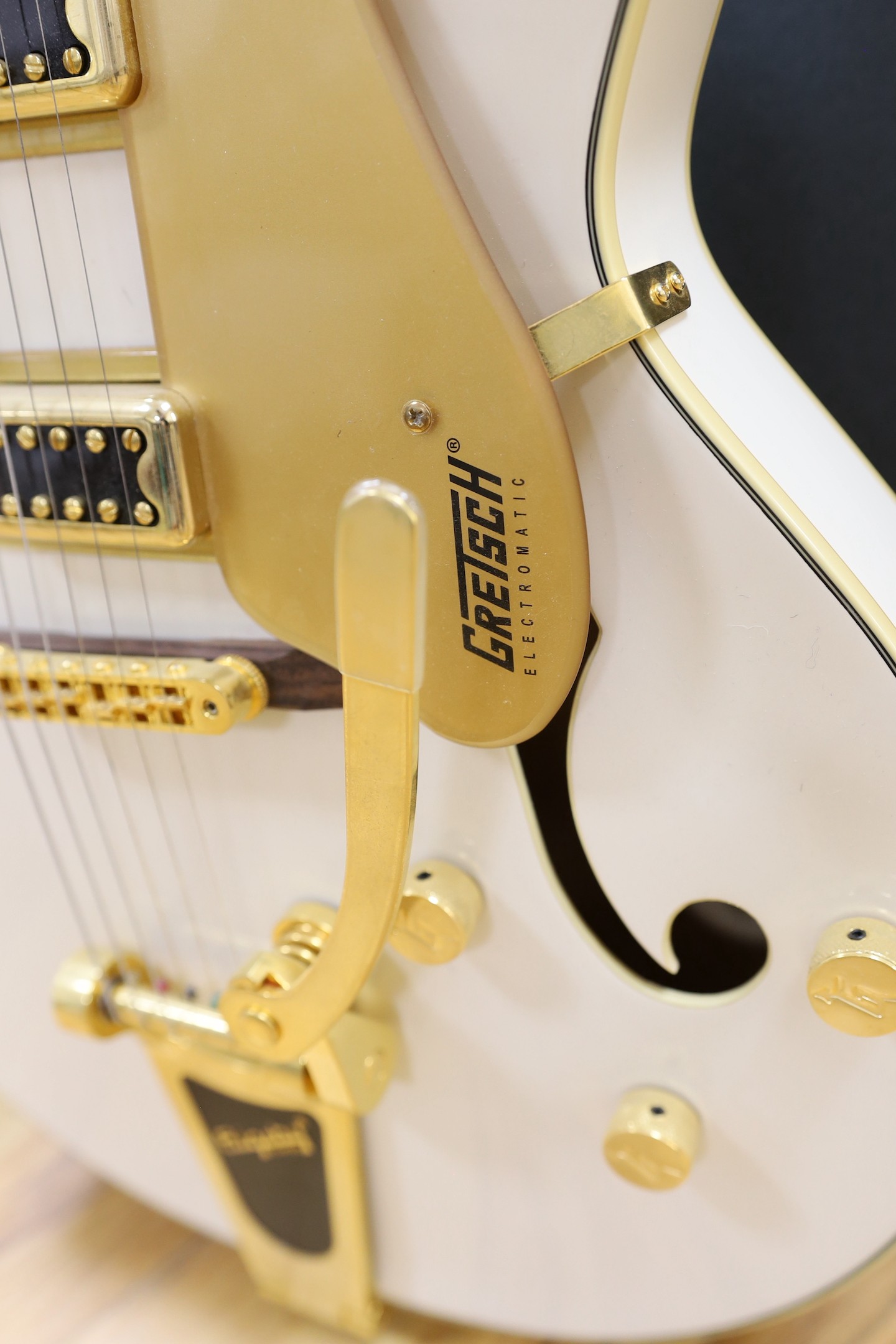 A Gretsch Bigsby electromatic guitar with case